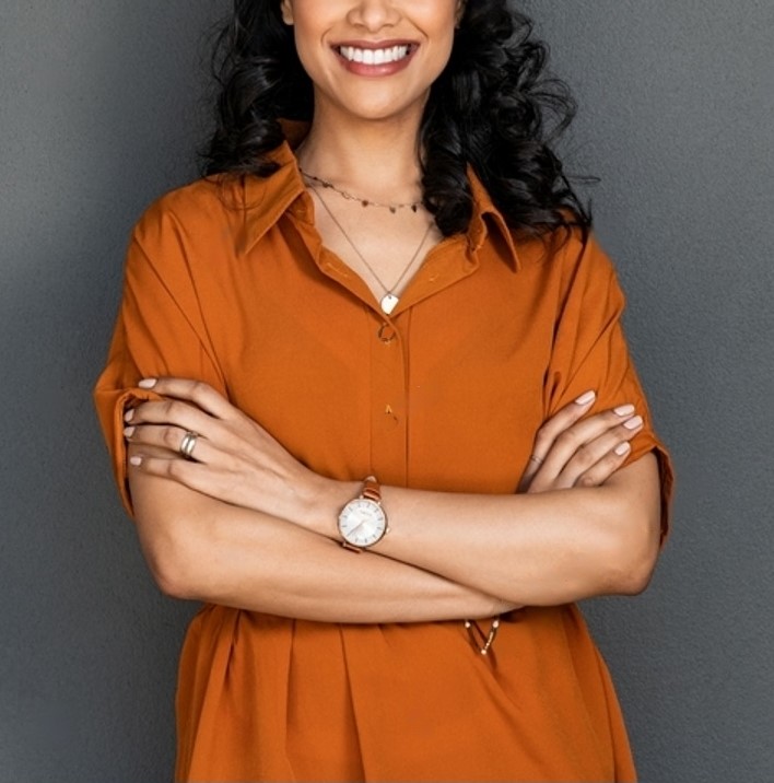 stock-photo-portrait-of-a-young-latin-woman-with-pleasant-smile-and-crossed-arms-isolated-on-grey-wall-with-2151833739-transformed